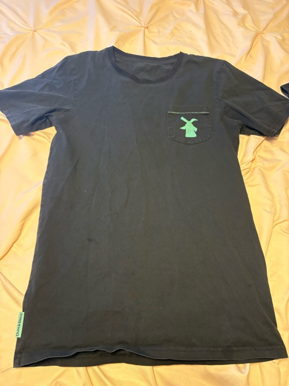 Woman’s Black Pocket T-Shirt with Green Dutch bros Logo